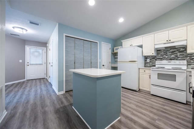 6355 NW 106th Pl, Alachua, FL 32615 - kitchen with decorative backsplash, visible vents, under cabinet range hood, white appliances, and white cabinetry