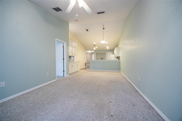 6355 NW 106th Pl, Alachua, FL 32615 - unfurnished living room featuring visible vents, light carpet, baseboards, ceiling fan, and vaulted ceiling