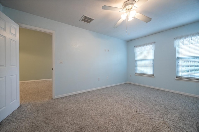 6355 NW 106th Pl, Alachua, FL 32615 - carpeted spare room with baseboards, a ceiling fan, and visible vents