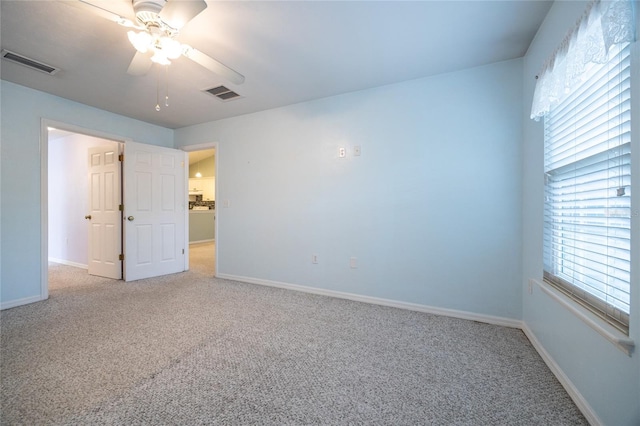 6355 NW 106th Pl, Alachua, FL 32615 - unfurnished bedroom with carpet floors, baseboards, and visible vents