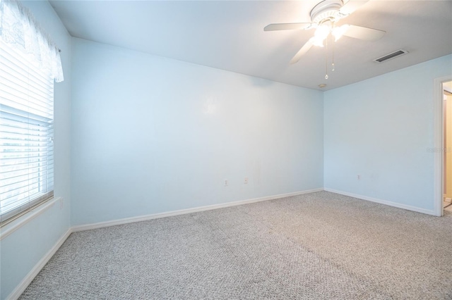 6355 NW 106th Pl, Alachua, FL 32615 - unfurnished room with visible vents, carpet flooring, baseboards, and ceiling fan