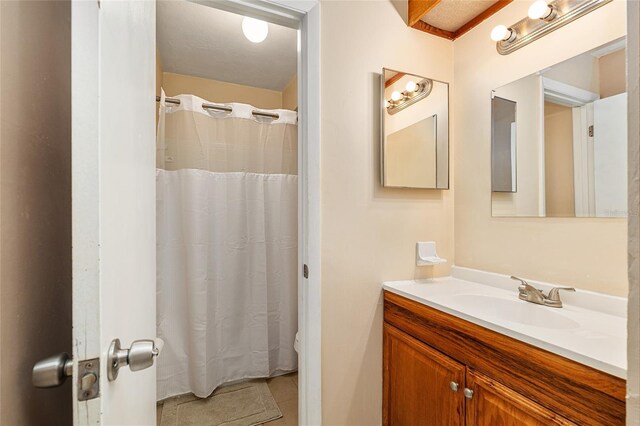 bathroom with vanity, tile patterned flooring, and a shower with curtain