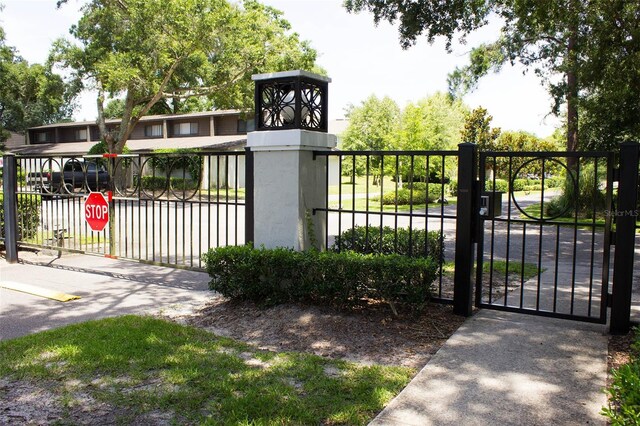 view of gate with fence