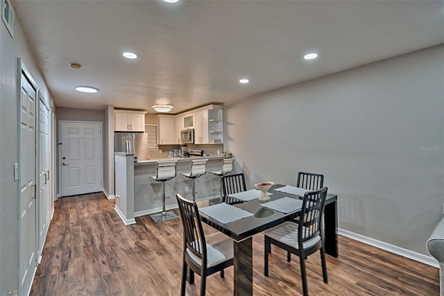 105 SE 16th Ave Unit N103, Gainesville, FL 32601 - dining space with dark wood finished floors and recessed lighting