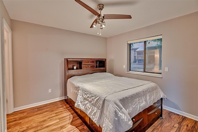 105 SE 16th Ave Unit N103, Gainesville, FL 32601 - bedroom with wood finished floors and ceiling fan