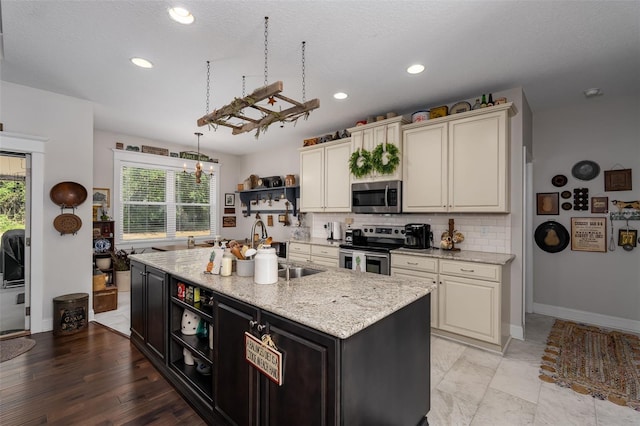 kitchen with plenty of natural light, open shelves, baseboards, and appliances with stainless steel finishes