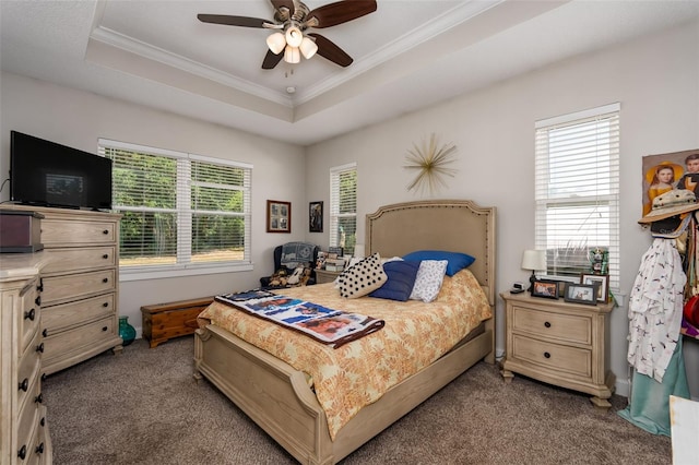 bedroom with crown molding, carpet flooring, a raised ceiling, and ceiling fan