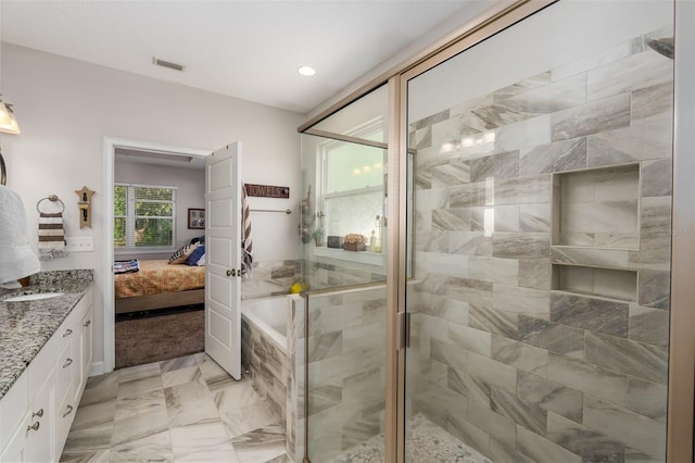 bathroom with ensuite bathroom, a stall shower, and visible vents