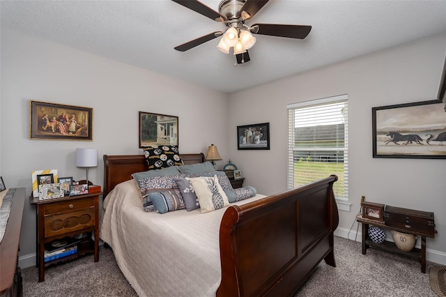 bedroom featuring carpet floors, a ceiling fan, and baseboards