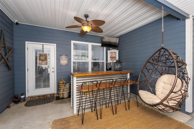 exterior space featuring ceiling fan