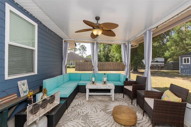 sunroom with ceiling fan and outdoor lounge area