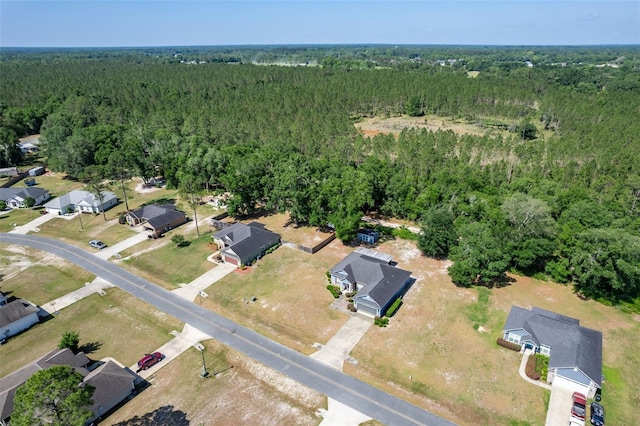 aerial view with a residential view and a wooded view