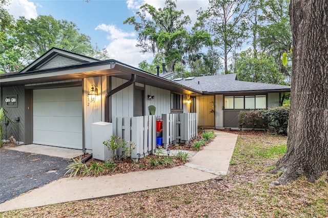 1612 NW 19th Cir, Gainesville, FL 32605 - view of front of property featuring a garage, fence, and driveway