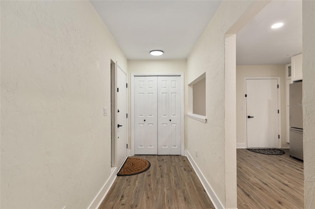 1612 NW 19th Cir, Gainesville, FL 32605 - hall featuring baseboards and wood finished floors