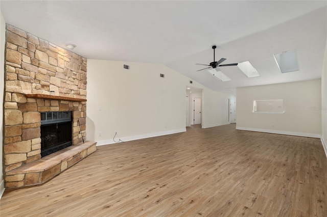 1612 NW 19th Cir, Gainesville, FL 32605 - unfurnished living room featuring a fireplace, wood finished floors, and visible vents