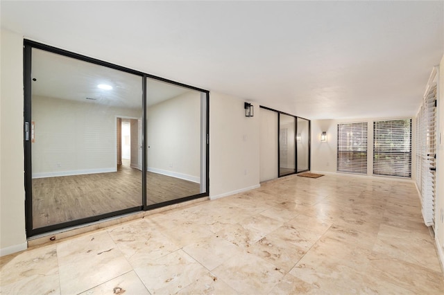1612 NW 19th Cir, Gainesville, FL 32605 - interior space featuring baseboards, multiple windows, and multiple closets