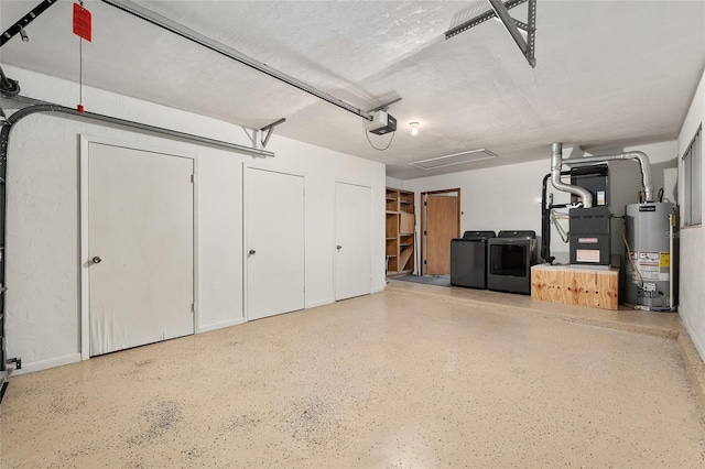 1612 NW 19th Cir, Gainesville, FL 32605 - garage featuring a garage door opener, heating unit, water heater, and washing machine and dryer