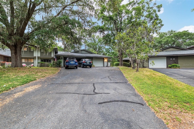 1612 NW 19th Cir, Gainesville, FL 32605 - split level home with driveway and a front lawn