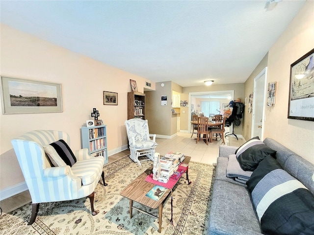 living room featuring baseboards