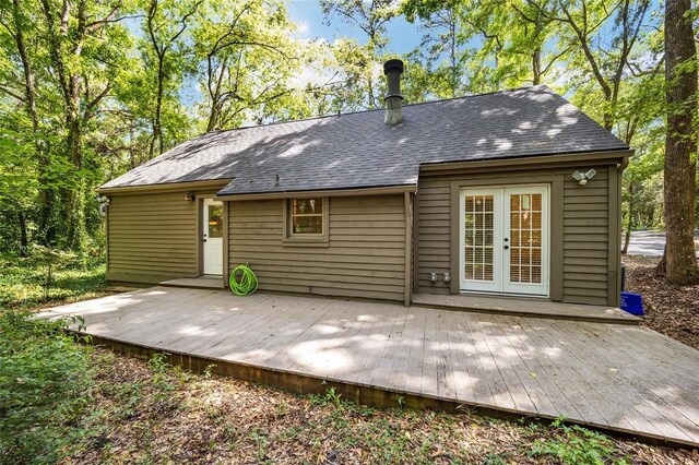 4511 SW 83rd Dr, Gainesville, FL 32608 - back of property featuring a wooden deck, french doors, and roof with shingles
