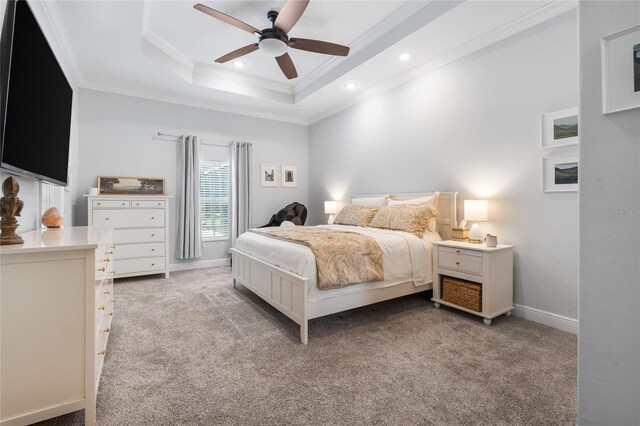 bedroom featuring recessed lighting, ornamental molding, a raised ceiling, and light carpet