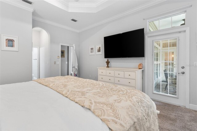 carpeted bedroom with arched walkways, access to outside, ornamental molding, and visible vents