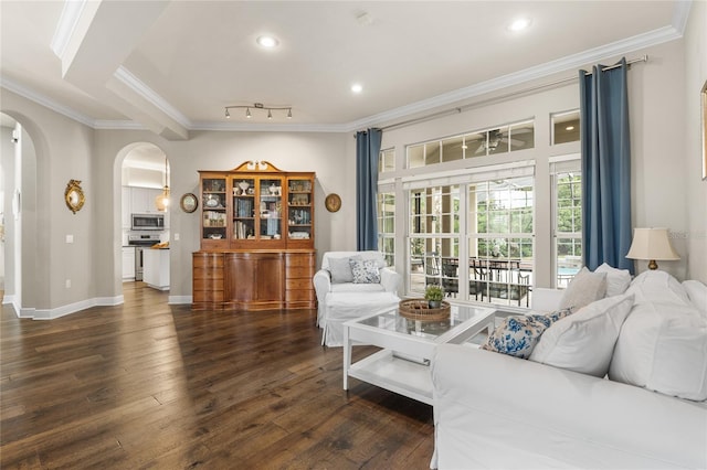 living area featuring crown molding, arched walkways, recessed lighting, and dark wood-style floors