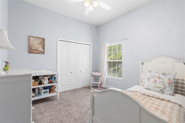 carpeted bedroom with a closet and ceiling fan