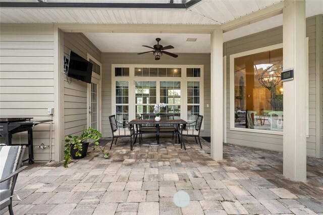 view of patio / terrace with a ceiling fan and outdoor dining area