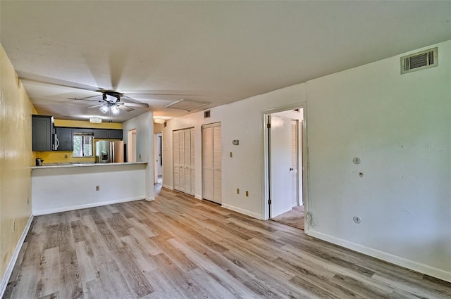 111 SE 16th Ave Unit O304, Gainesville, FL 32601 - unfurnished living room with light wood-style flooring and a ceiling fan