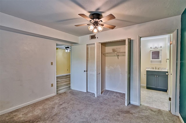 111 SE 16th Ave Unit O304, Gainesville, FL 32601 - unfurnished bedroom with light carpet and ceiling fan