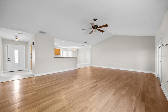 unfurnished living room with a ceiling fan, baseboards, visible vents, and light wood-type flooring