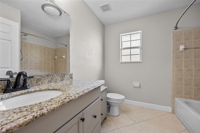 bathroom featuring visible vents, shower / tub combination, tile patterned floors, vanity, and toilet