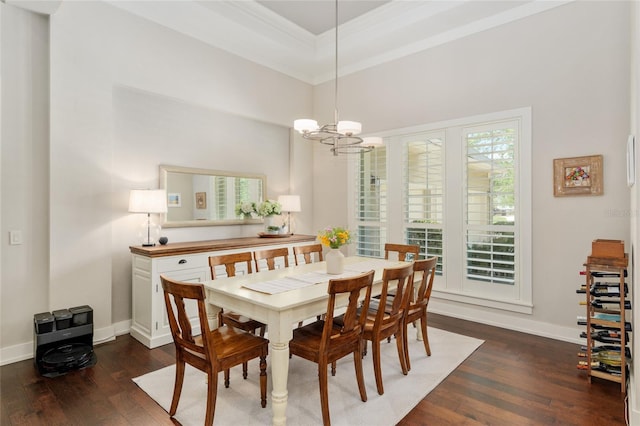 dining room featuring an inviting chandelier, baseboards, ornamental molding, and hardwood / wood-style flooring