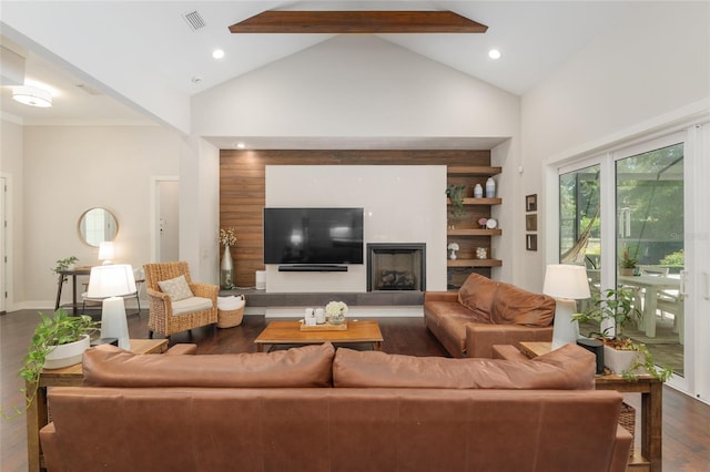 living area featuring a fireplace with raised hearth, high vaulted ceiling, recessed lighting, dark wood-type flooring, and visible vents