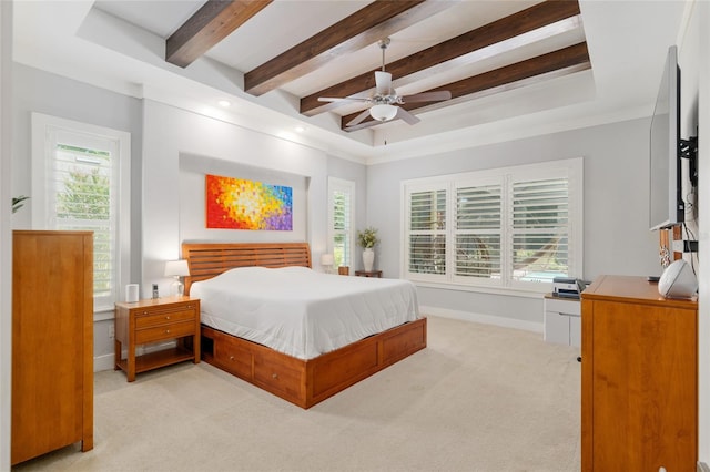 bedroom featuring baseboards, ceiling fan, beamed ceiling, and light colored carpet