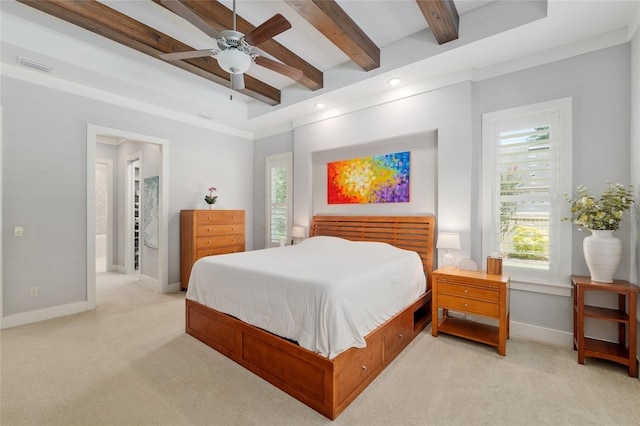 bedroom with beamed ceiling, visible vents, light carpet, and baseboards