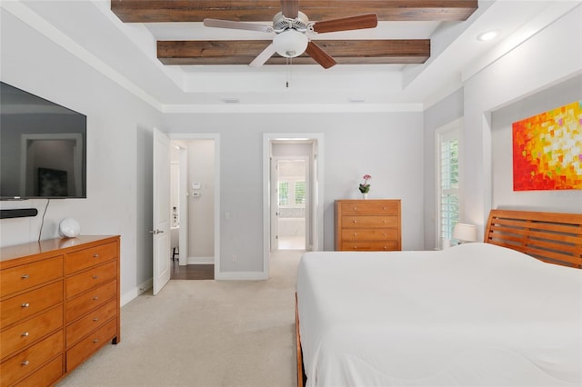 bedroom with a raised ceiling, baseboards, beam ceiling, and light colored carpet