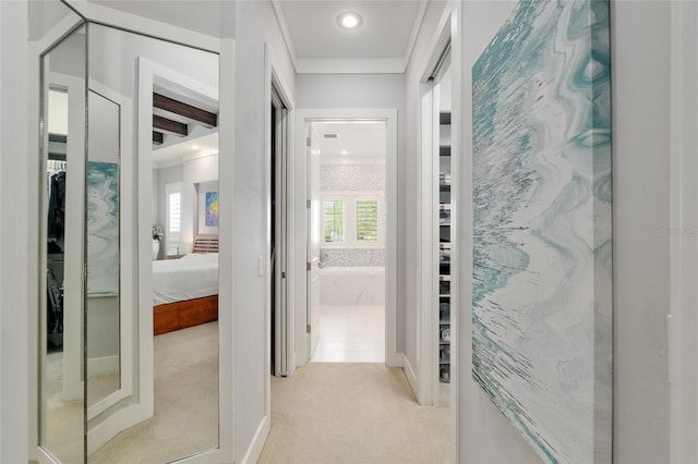 hall featuring recessed lighting, light colored carpet, and a wealth of natural light