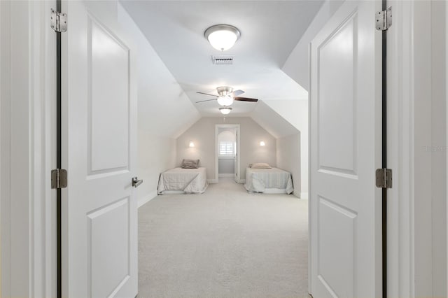 bedroom with carpet floors, visible vents, baseboards, a ceiling fan, and vaulted ceiling