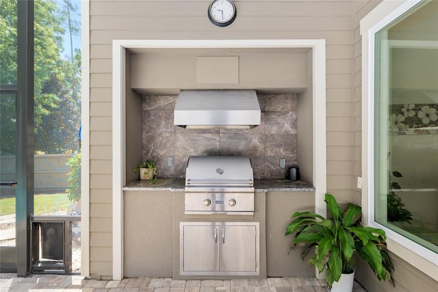 view of patio / terrace with an outdoor kitchen and area for grilling