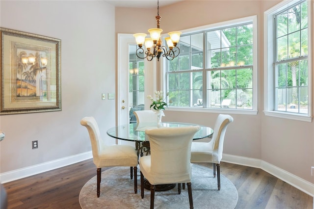 4515 SW 97th Ter, Gainesville, FL 32608 - dining room featuring baseboards, a chandelier, and dark wood finished floors