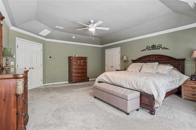 4515 SW 97th Ter, Gainesville, FL 32608 - carpeted bedroom featuring lofted ceiling, a closet, a ceiling fan, ornamental molding, and baseboards