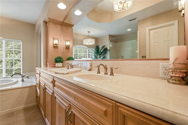 4515 SW 97th Ter, Gainesville, FL 32608 - bathroom with plenty of natural light, a shower stall, a garden tub, double vanity, and recessed lighting