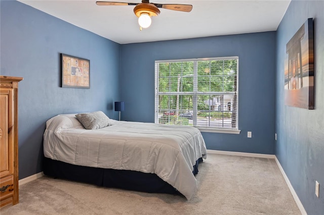 4515 SW 97th Ter, Gainesville, FL 32608 - carpeted bedroom featuring multiple windows, baseboards, and ceiling fan