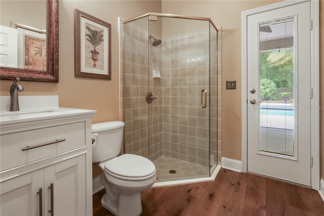 4515 SW 97th Ter, Gainesville, FL 32608 - bathroom featuring wood finished floors, a stall shower, and vanity