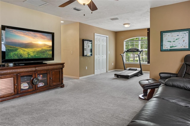 4515 SW 97th Ter, Gainesville, FL 32608 - carpeted living area with baseboards, a ceiling fan, and a textured ceiling