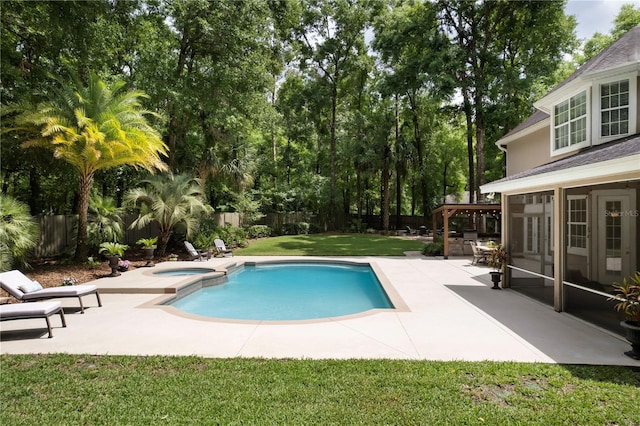 4515 SW 97th Ter, Gainesville, FL 32608 - view of swimming pool featuring a patio, view of wooded area, and a pool with connected hot tub