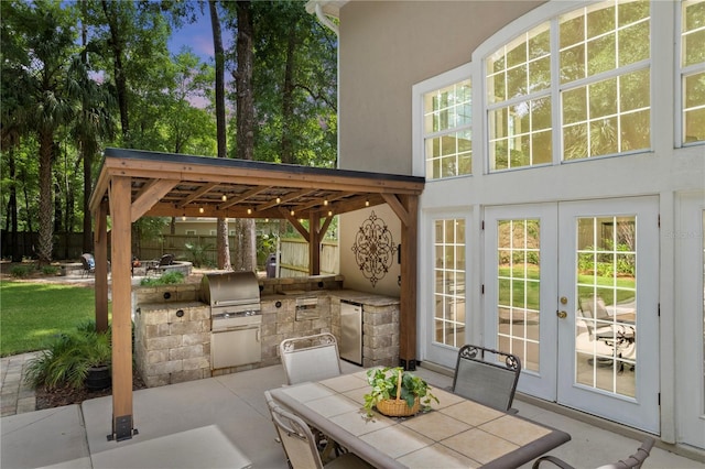 4515 SW 97th Ter, Gainesville, FL 32608 - view of patio / terrace with french doors, area for grilling, fence, a grill, and outdoor dining space