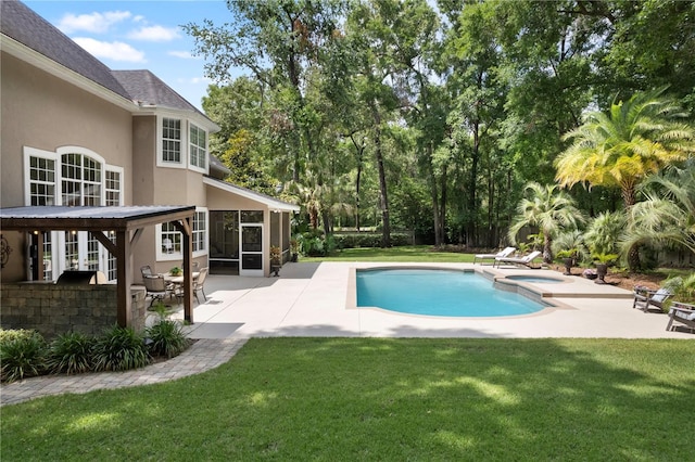 4515 SW 97th Ter, Gainesville, FL 32608 - view of swimming pool featuring a patio, a yard, a sunroom, a pool with connected hot tub, and view of scattered trees
